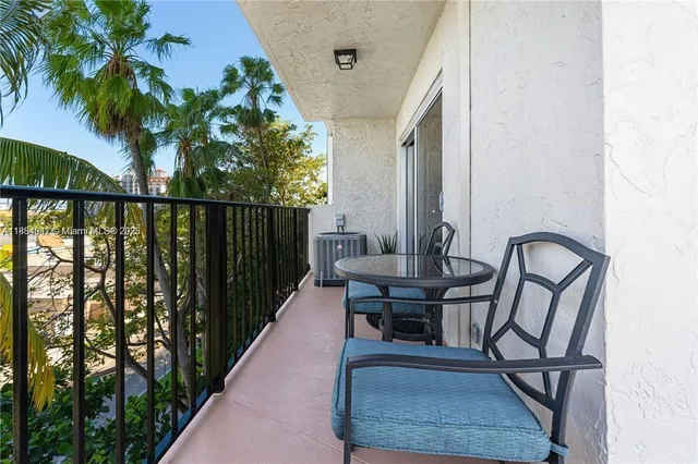 a view of balcony with furniture
