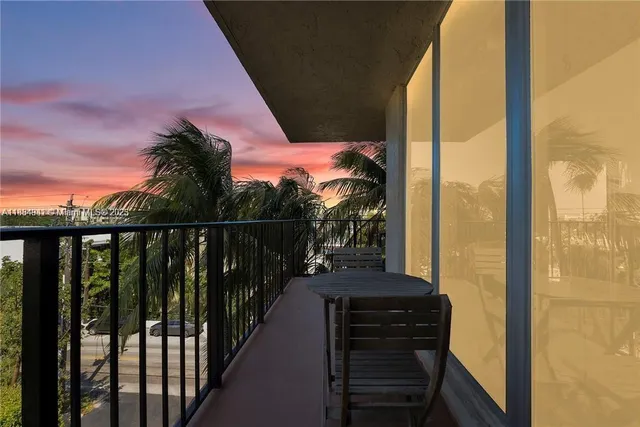 a balcony with wooden floor