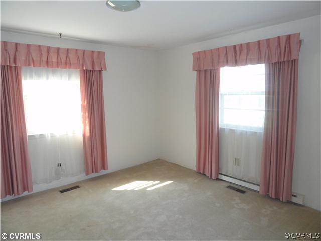 3215 Sylvania Road Chester, VA 23831 - Photo 7 of 11 an empty room with a window