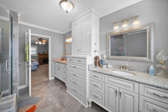 a bathroom with a double vanity sink mirror and double