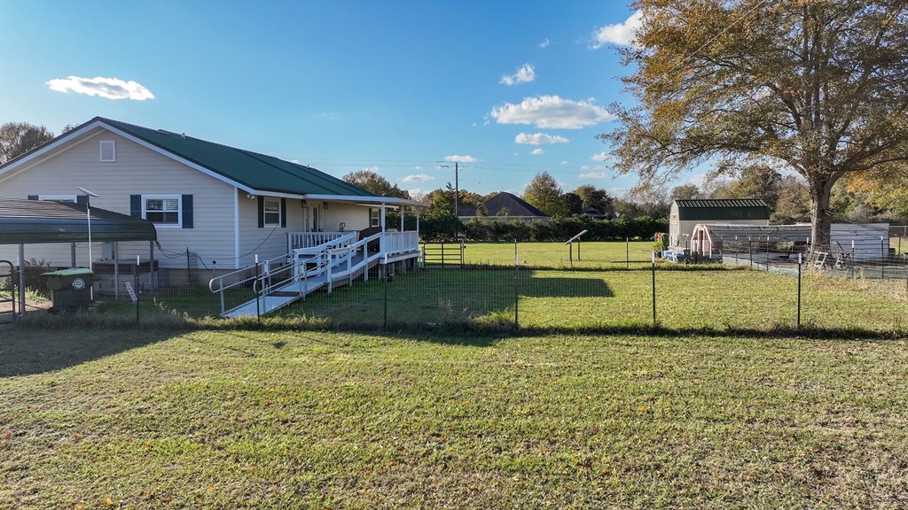 4300 Green Road Ellaville, GA 31806 - Photo 24 of 41 a view of a house with a big yard and potted plants