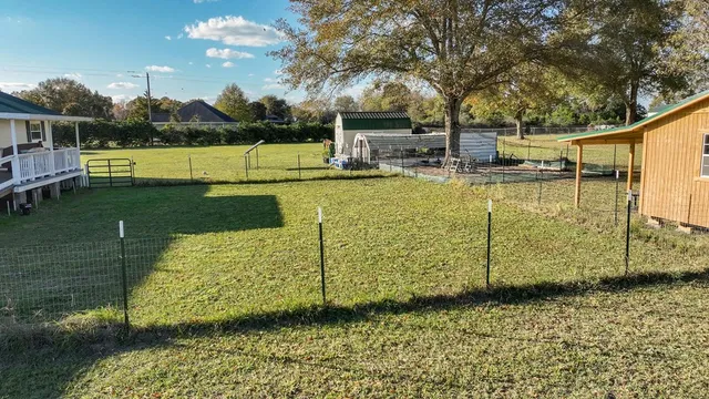 a view of a swimming pool with a patio