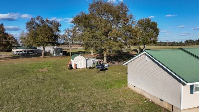 a view of a backyard with table and chairs and a mountain