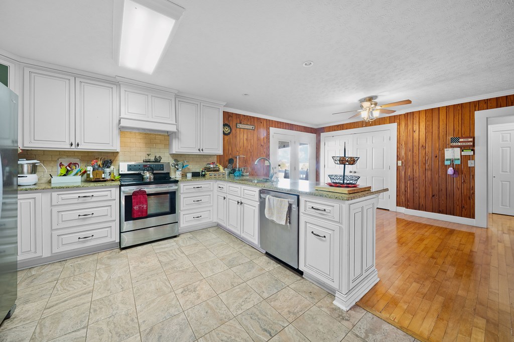 4300 Green Road Ellaville, GA 31806 - Photo 8 of 41 a kitchen with white cabinets and white appliances