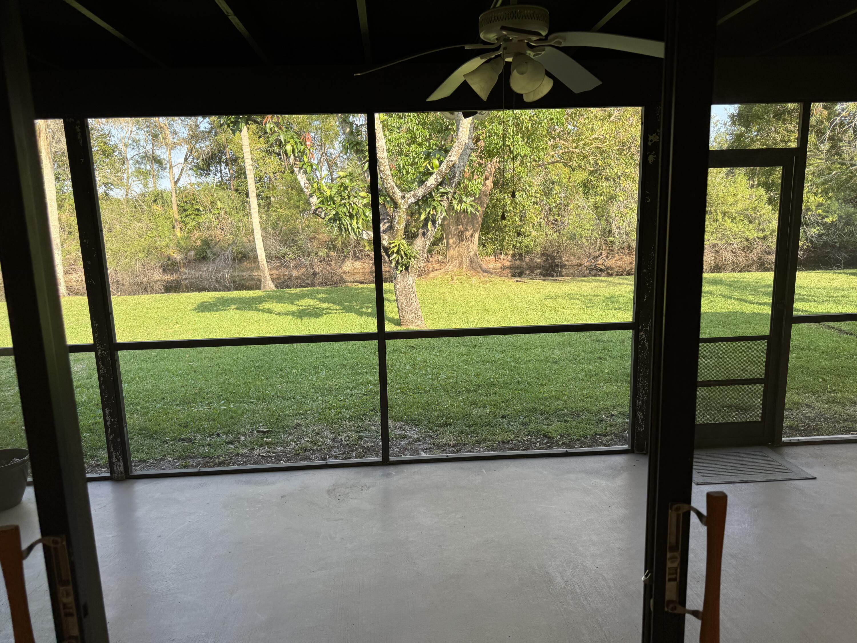21068 Shady Vista Lane Boca Raton, FL 33428 - Photo 32 of 42 VIEW FROM L. R. OF REAR YARD & CANAL