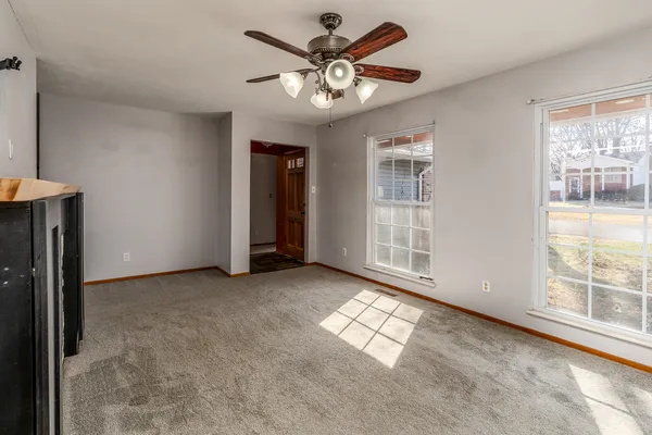 a view of an empty room with a window