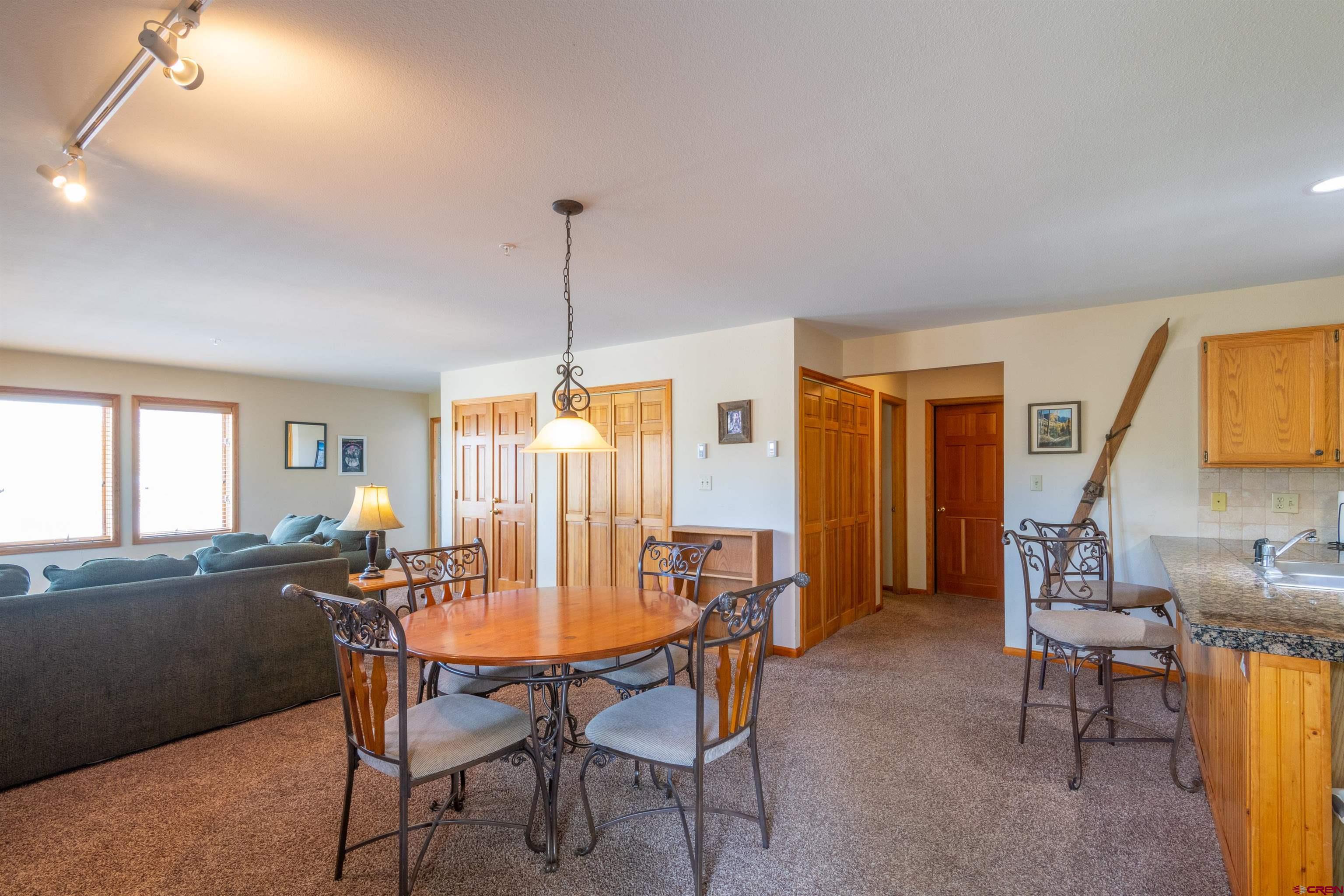 33 Castle Road, Unit 3 Crested Butte, CO 81225 - Photo 11 of 34 a view of a dining room with furniture and window