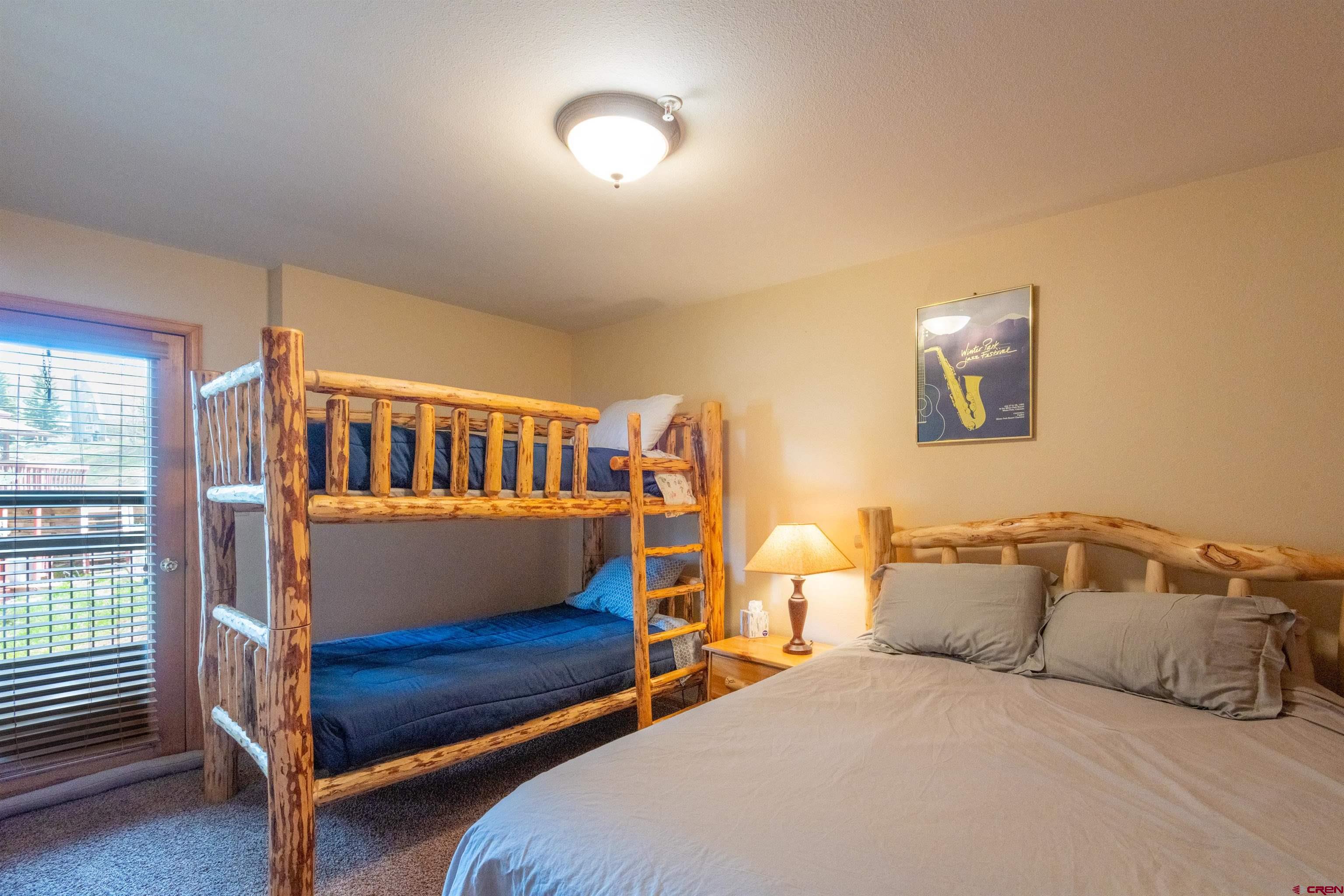 33 Castle Road, Unit 3 Crested Butte, CO 81225 - Photo 17 of 34 a bedroom with a bed and a window