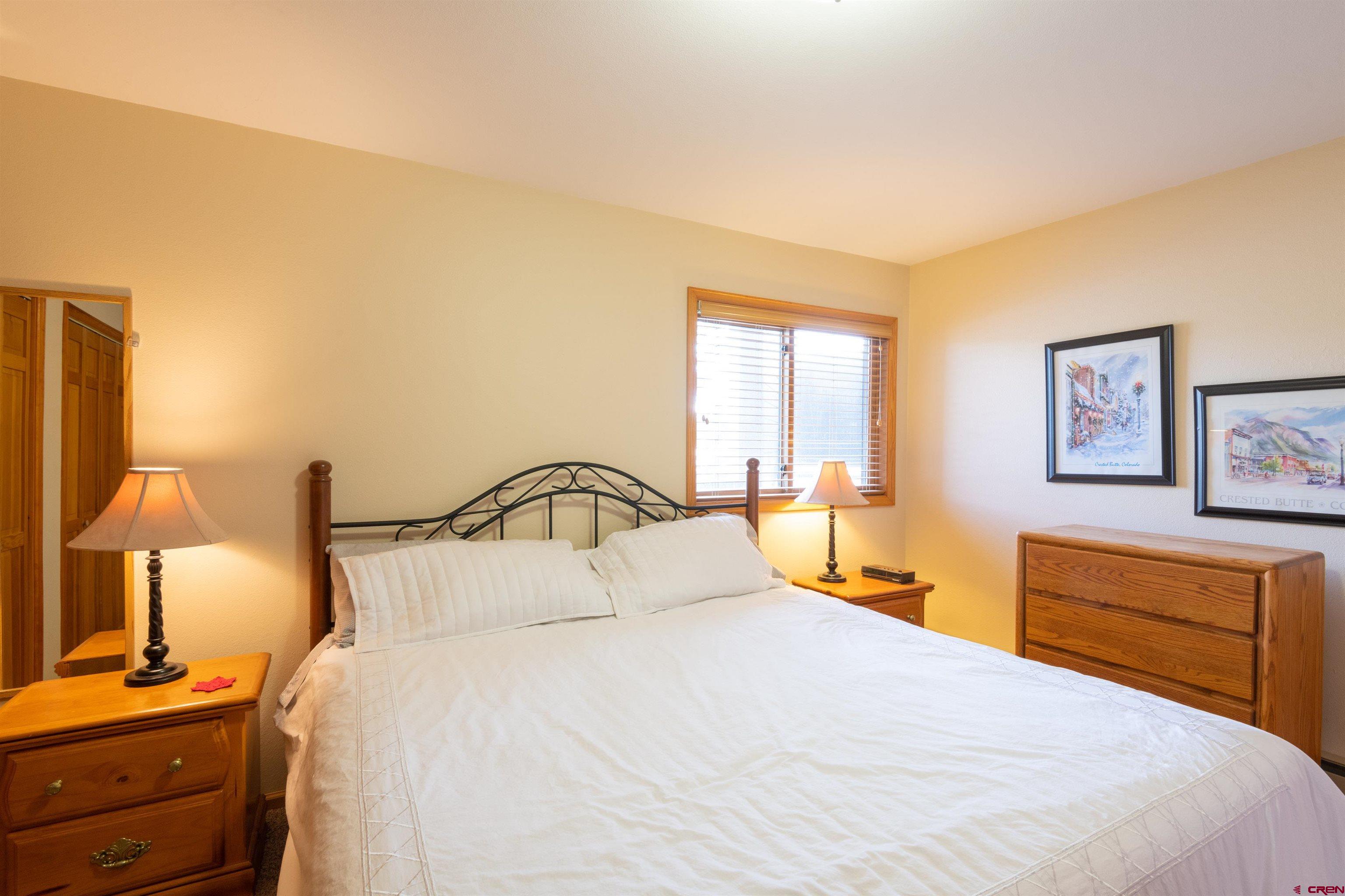 33 Castle Road, Unit 3 Crested Butte, CO 81225 - Photo 18 of 34 a bedroom with a bed and a lamp