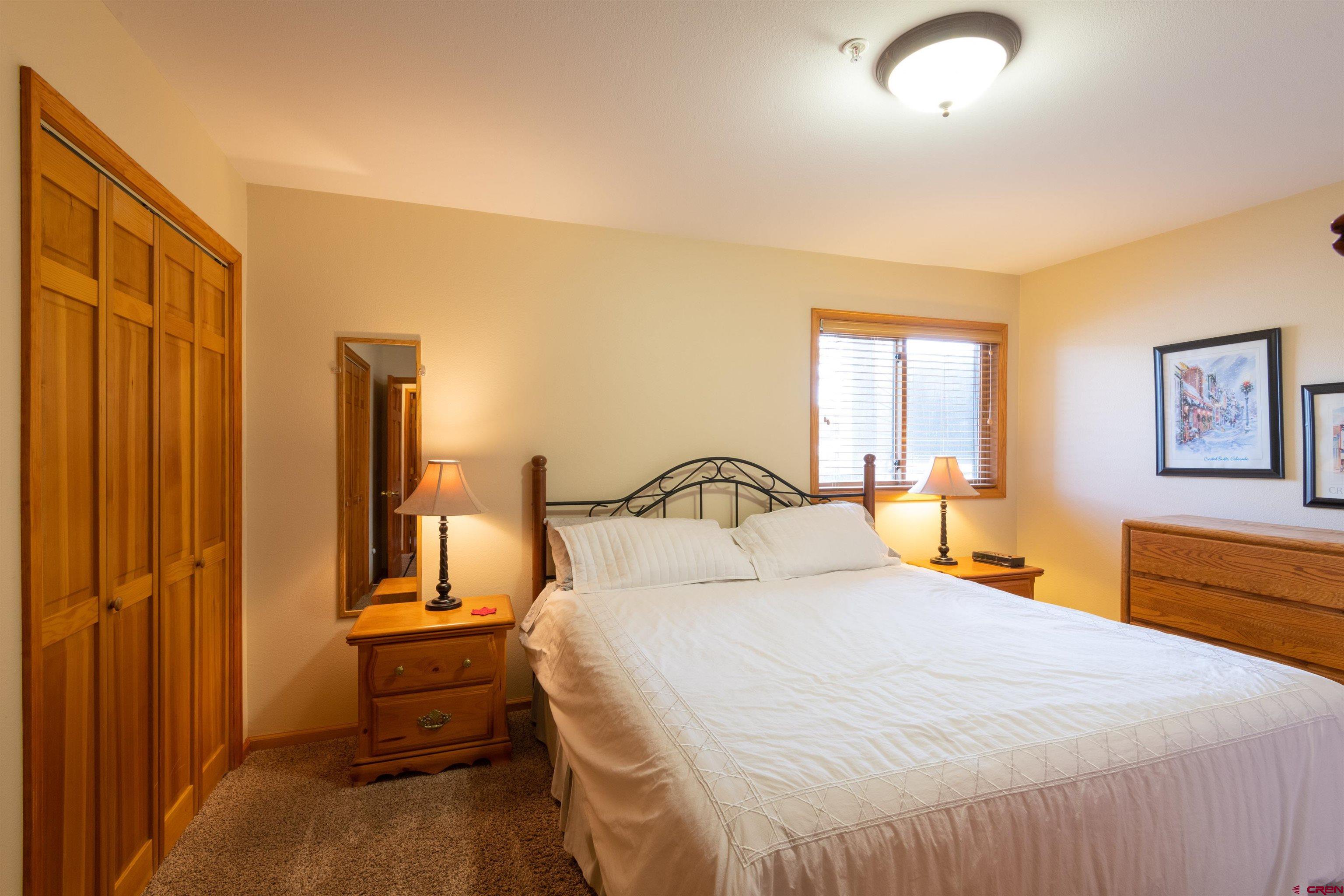 33 Castle Road, Unit 3 Crested Butte, CO 81225 - Photo 19 of 34 a bedroom with a bed and a dresser