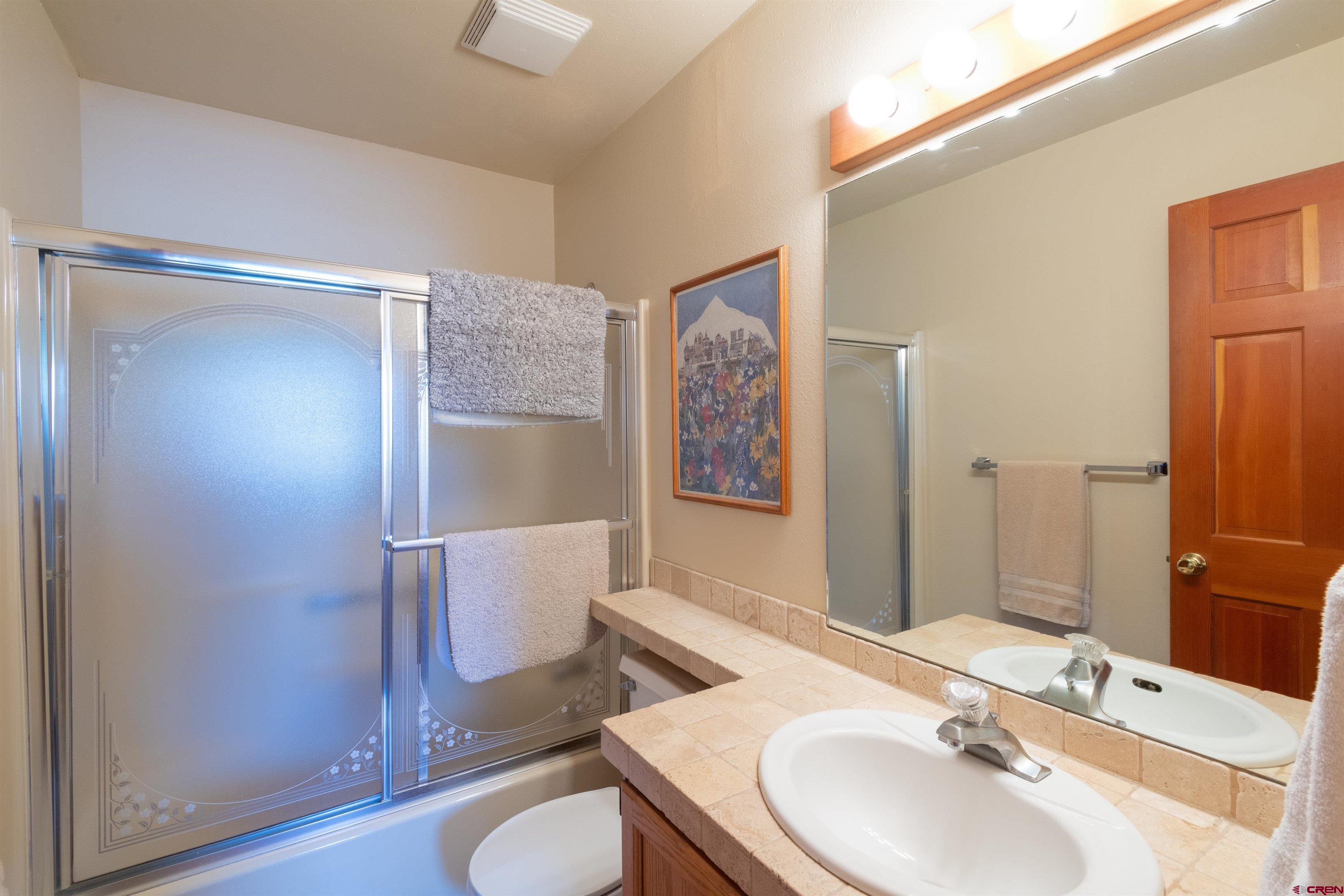33 Castle Road, Unit 3 Crested Butte, CO 81225 - Photo 20 of 34 a bathroom with a sink toilet and shower