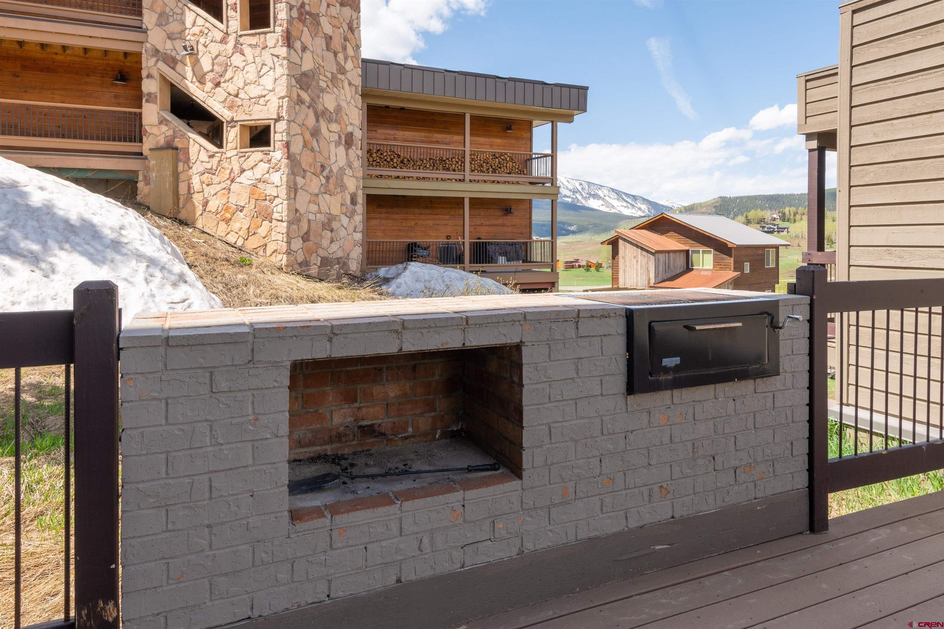 33 Castle Road, Unit 3 Crested Butte, CO 81225 - Photo 27 of 34 a stove top oven sitting next to a building