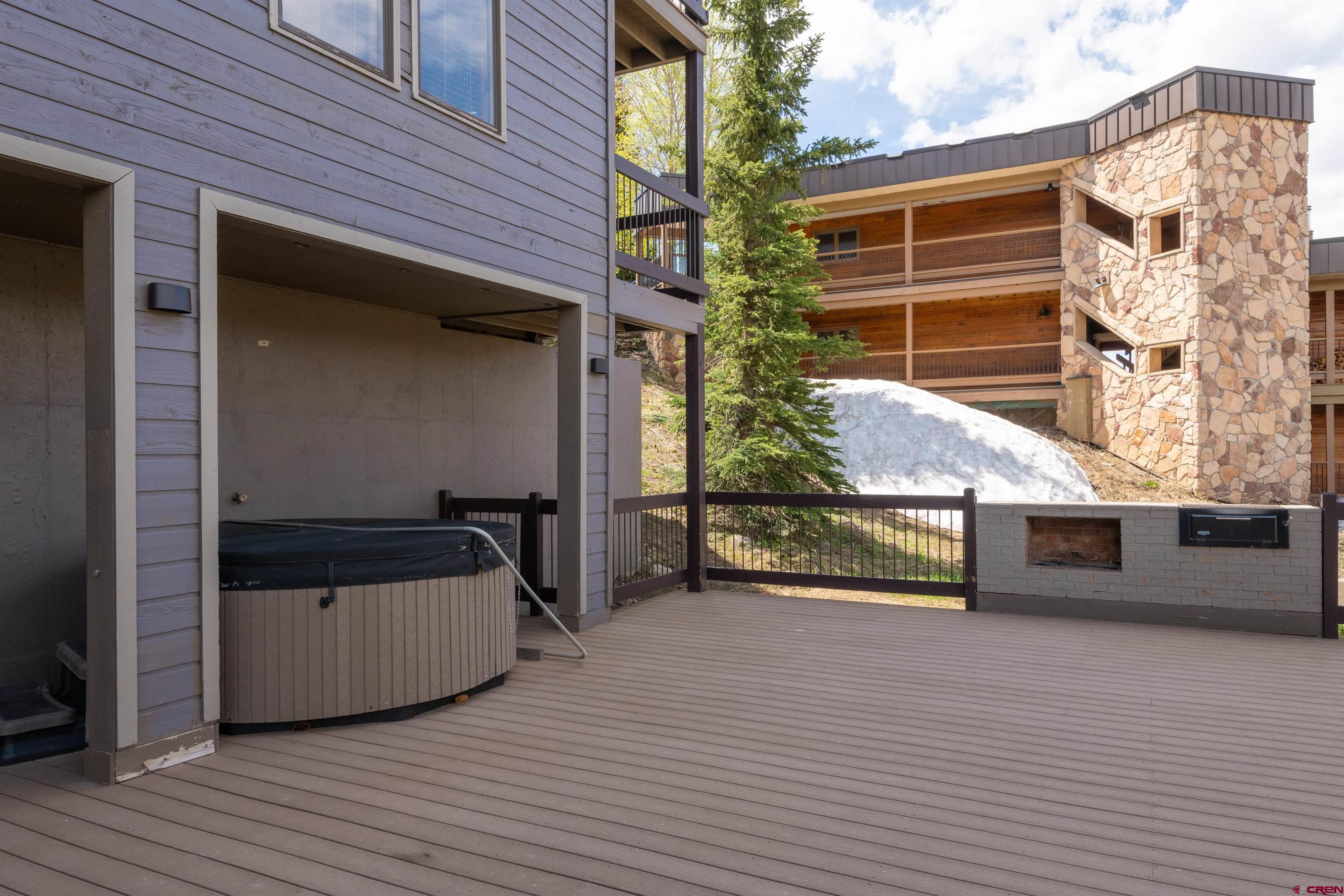 33 Castle Road, Unit 3 Crested Butte, CO 81225 - Photo 28 of 34 a view of a house with a door and wooden bench