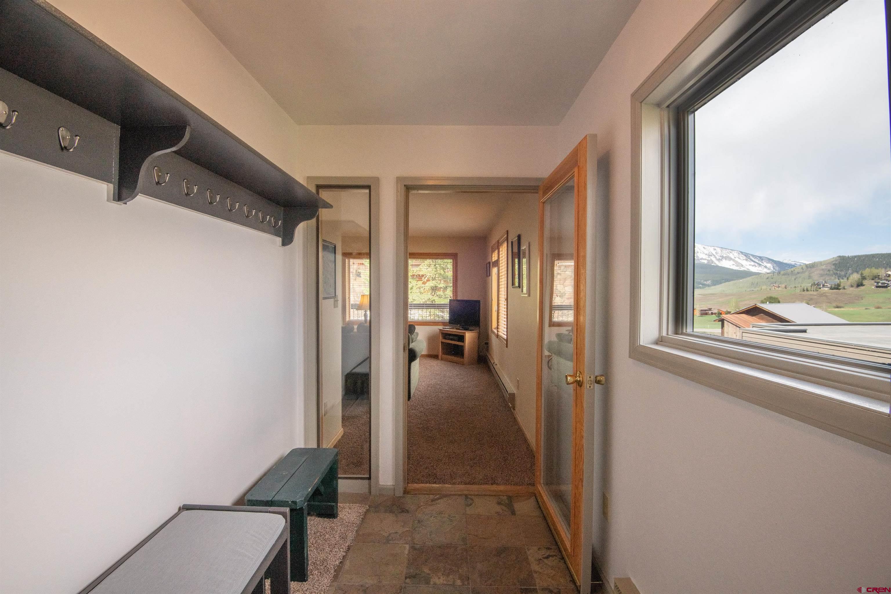 33 Castle Road, Unit 3 Crested Butte, CO 81225 - Photo 3 of 34 a view of hallway with furniture and a window