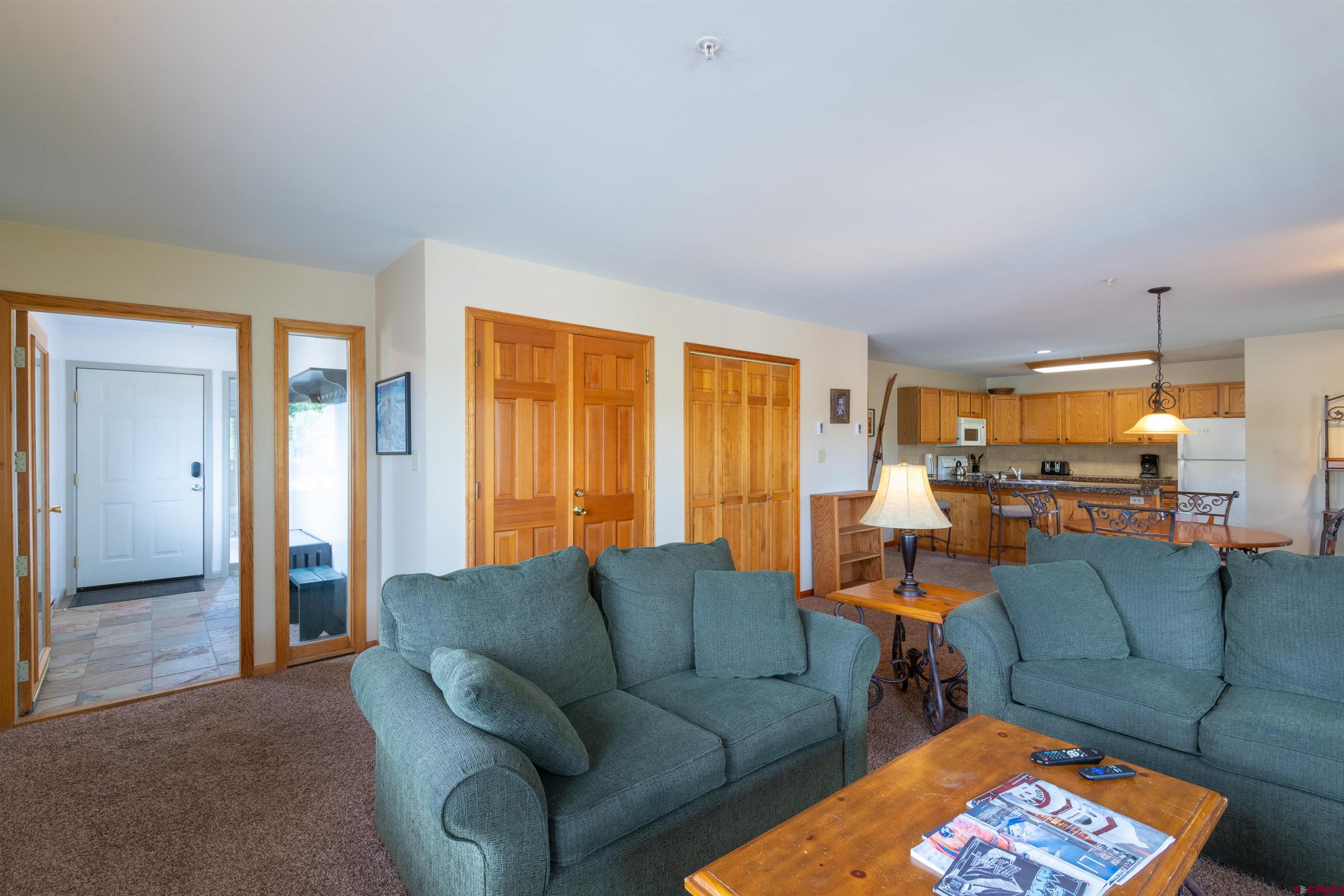 33 Castle Road, Unit 3 Crested Butte, CO 81225 - Photo 5 of 34 a living room with furniture and a large window