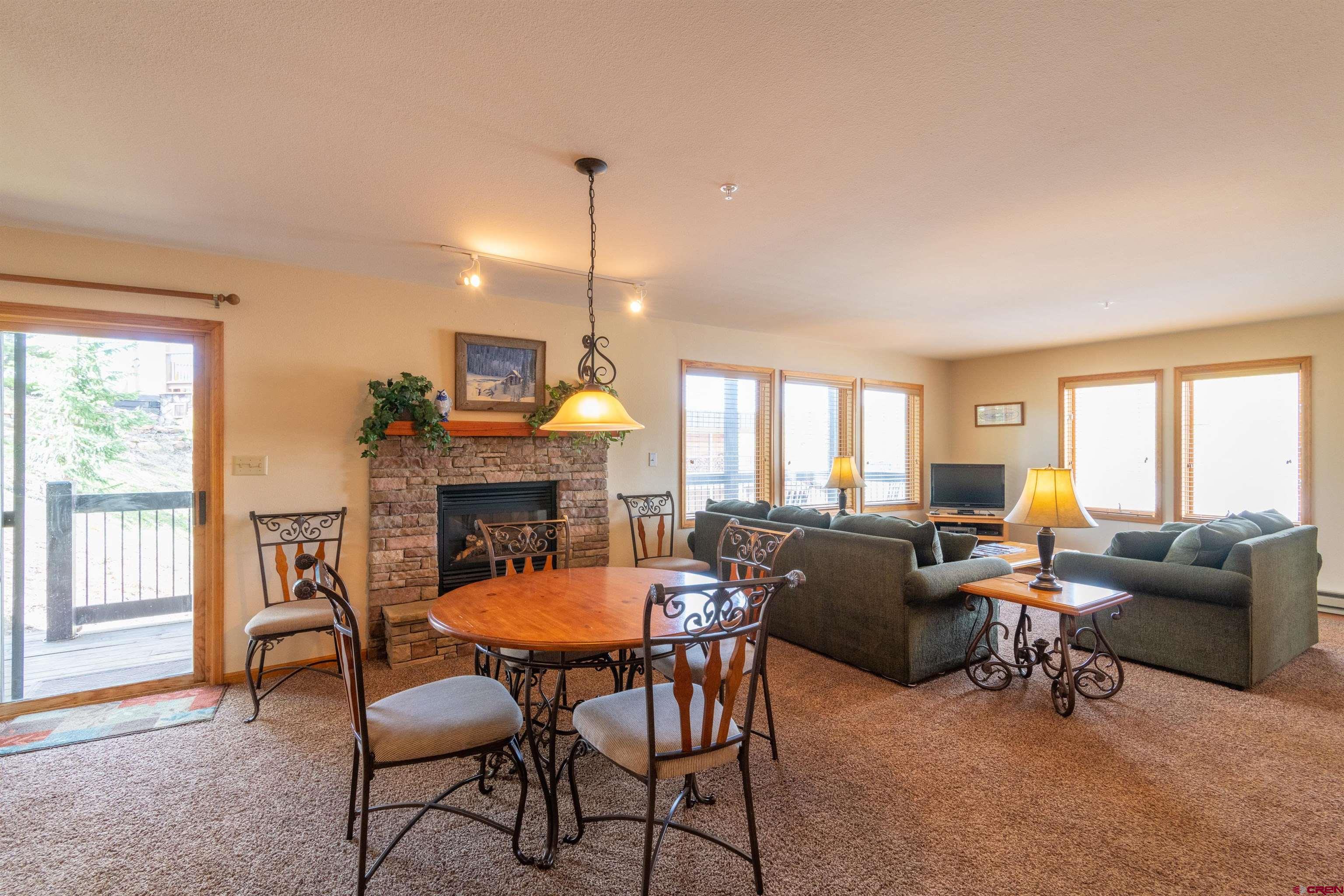 33 Castle Road, Unit 3 Crested Butte, CO 81225 - Photo 9 of 34 a view of a livingroom with furniture and a fireplace