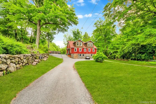 a view of a house with a yard and garage