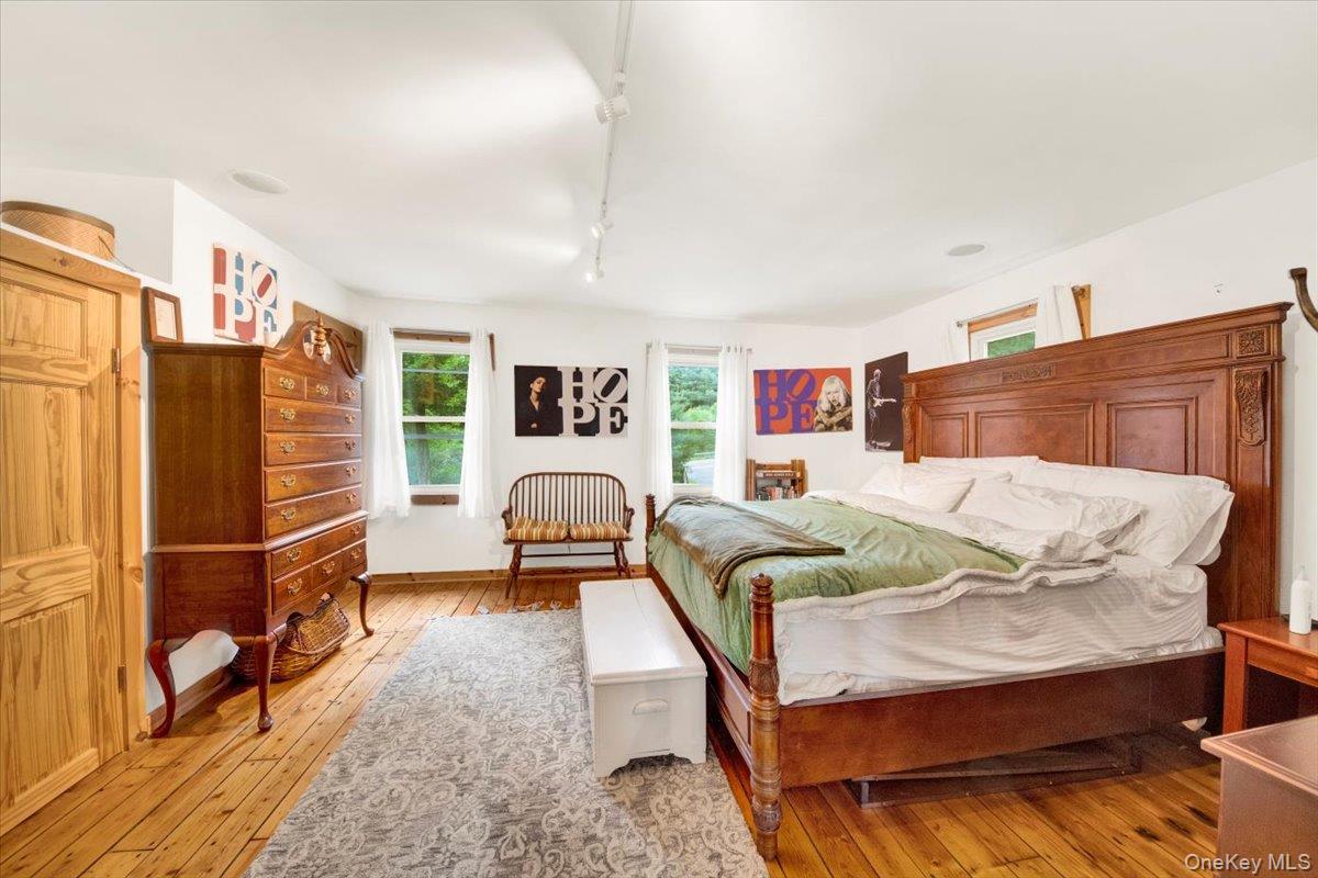 161 Goldens Bridge Road Katonah, NY 10536 - Photo 17 of 44 a bedroom with furniture and a walk in closet
