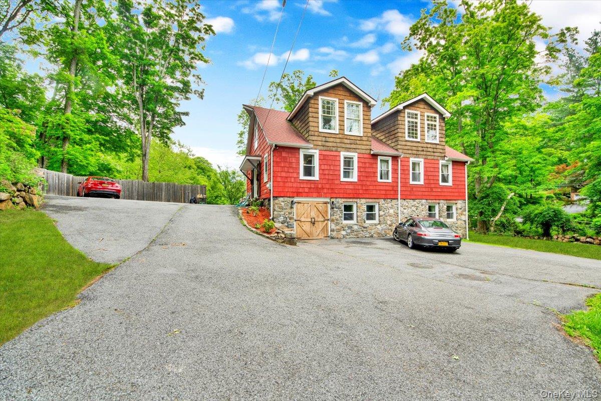 161 Goldens Bridge Road Katonah, NY 10536 - Photo 2 of 44 a view of a house with a yard and garage