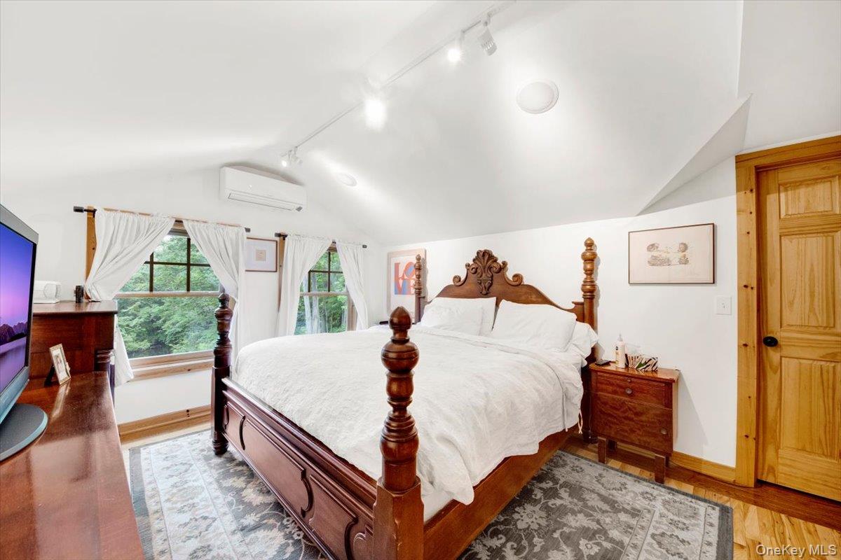 161 Goldens Bridge Road Katonah, NY 10536 - Photo 21 of 44 a bedroom with a bed and a large window