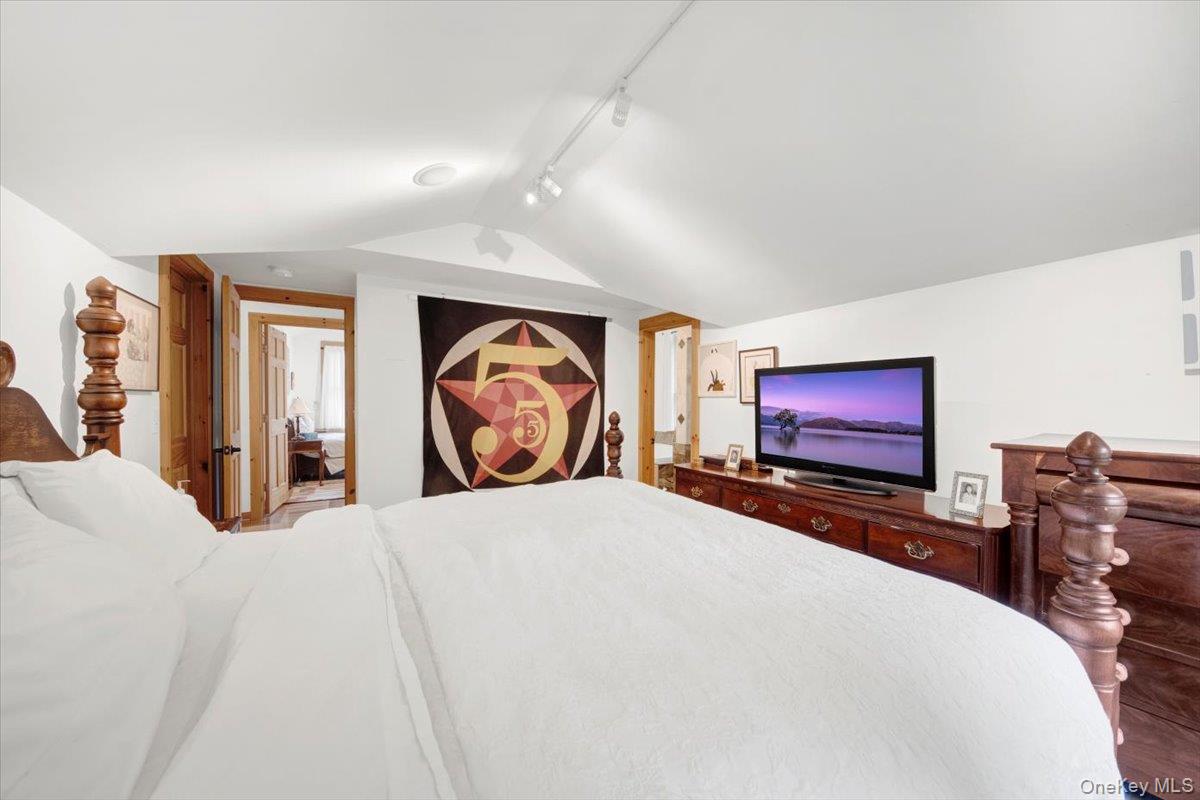 161 Goldens Bridge Road Katonah, NY 10536 - Photo 26 of 44 a bedroom with bed and a flat screen tv