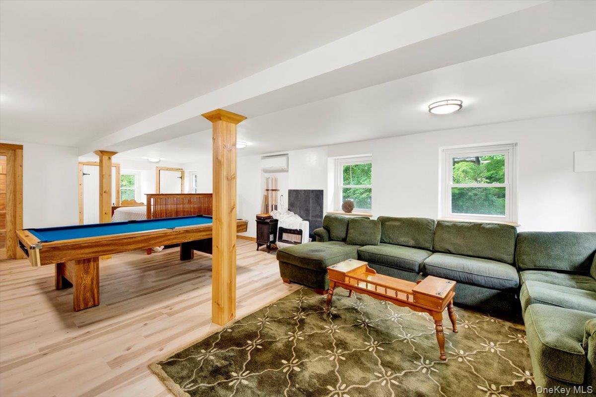 161 Goldens Bridge Road Katonah, NY 10536 - Photo 28 of 44 a living room with furniture a rug and a window