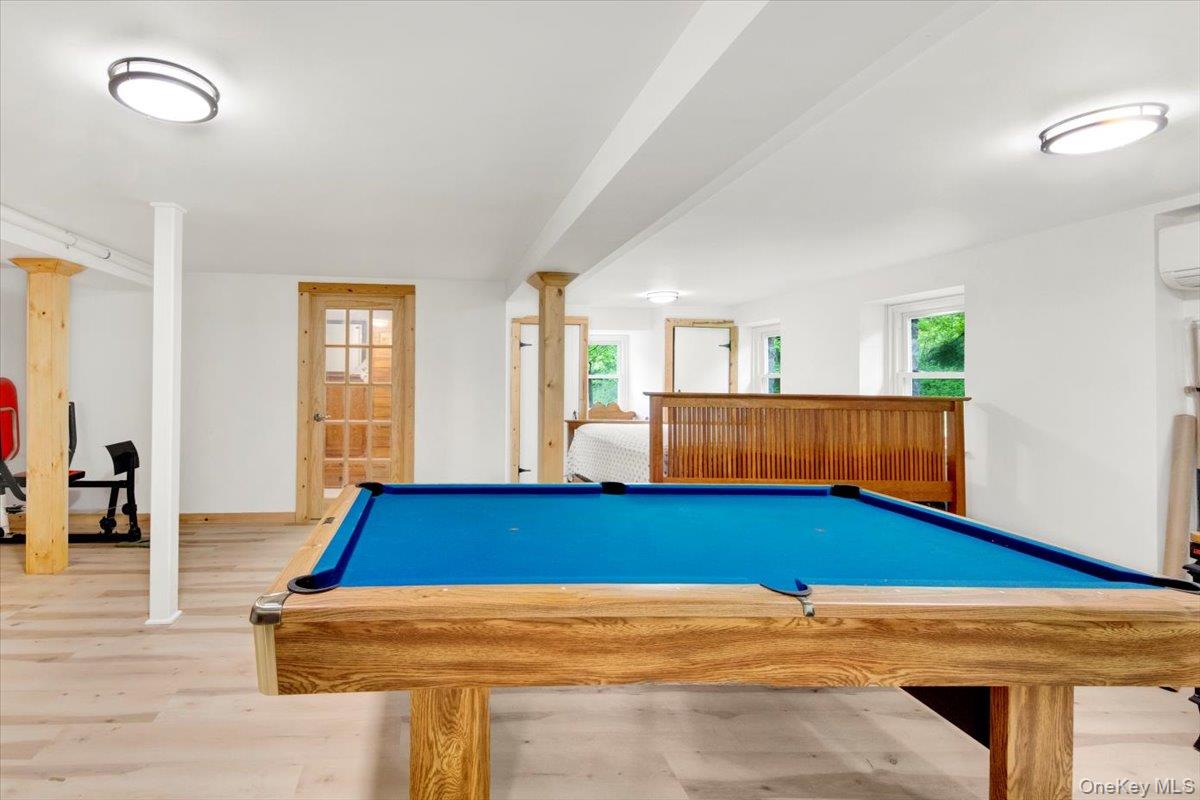 161 Goldens Bridge Road Katonah, NY 10536 - Photo 29 of 44 a room with wooden floor and pool table