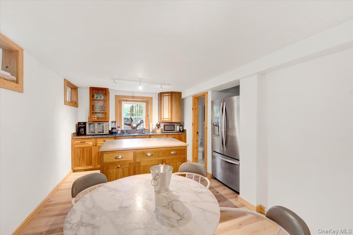 161 Goldens Bridge Road Katonah, NY 10536 - Photo 33 of 44 a living room with stainless steel appliances granite countertop furniture and a fireplace