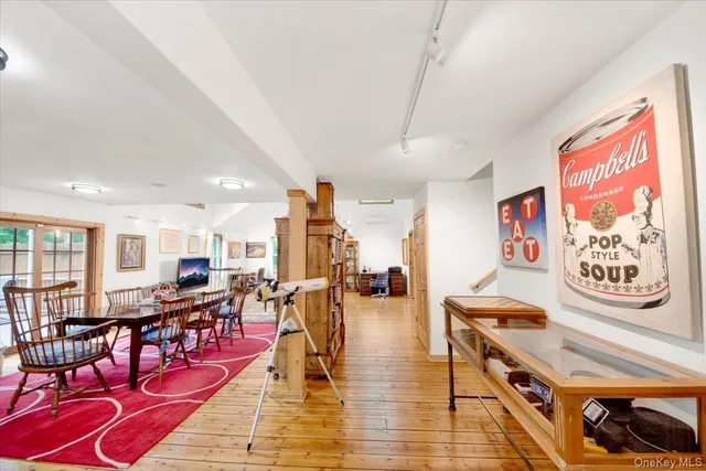a living room with lots of furniture and a book shelf