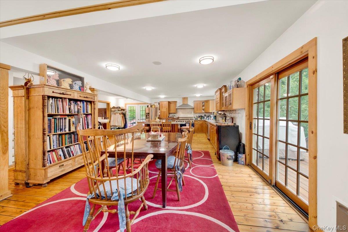 161 Goldens Bridge Road Katonah, NY 10536 - Photo 9 of 44 a living room with lots of furniture and a book shelf