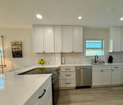 a kitchen with a sink and cabinets