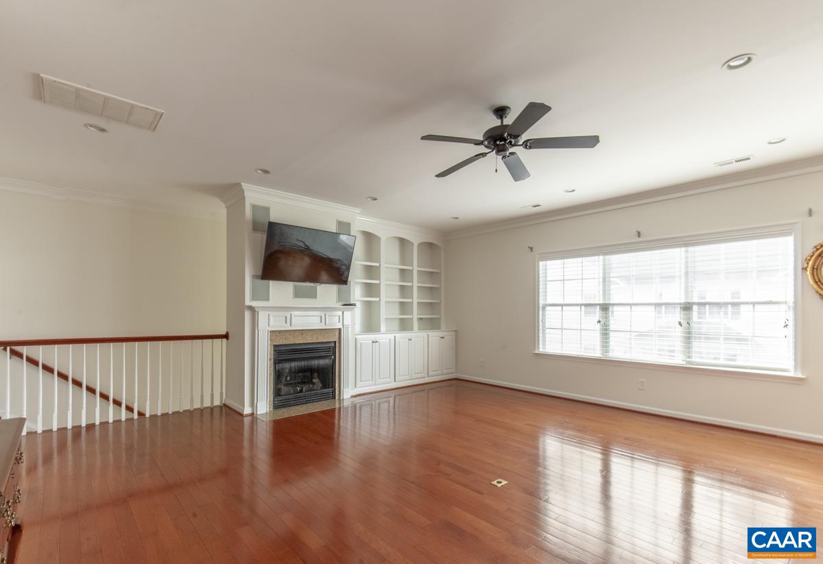 345 Quarry Road Charlottesville, VA 22902 - Photo 3 of 32 a view of an empty room with a window and fireplace