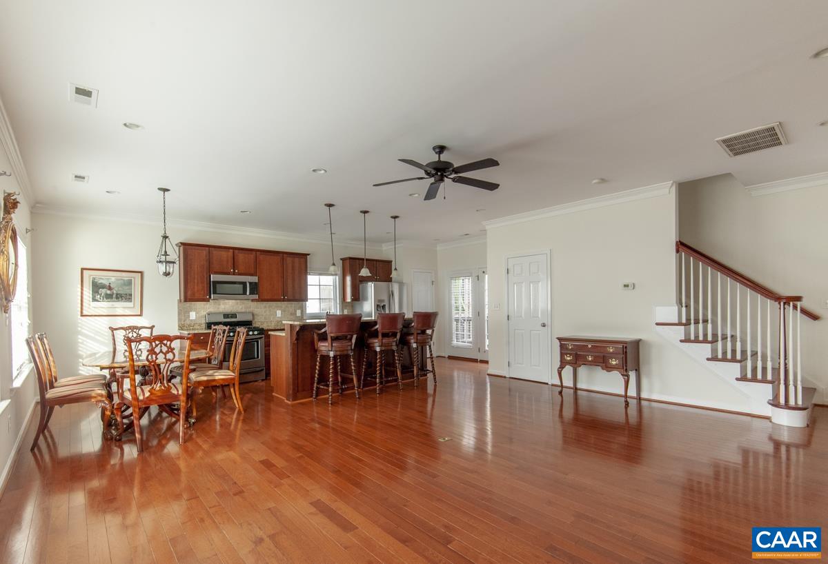 345 Quarry Road Charlottesville, VA 22902 - Photo 5 of 32 a living room with furniture dining table and a flat screen tv