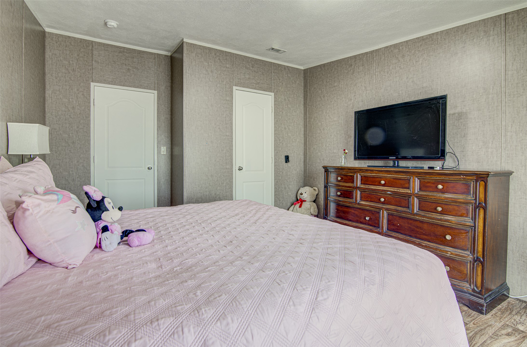 445 Rancho Linda Drive Lockhart, TX 78644 - Photo 23 of 26 The tranquil bedroom offers ample space, creating a peaceful personal retreat.