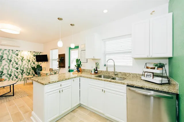 a kitchen with a sink stove and cabinets