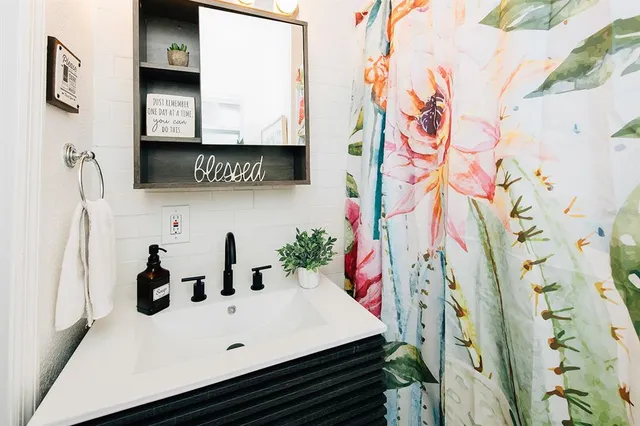 a bathroom with a sink and a mirror