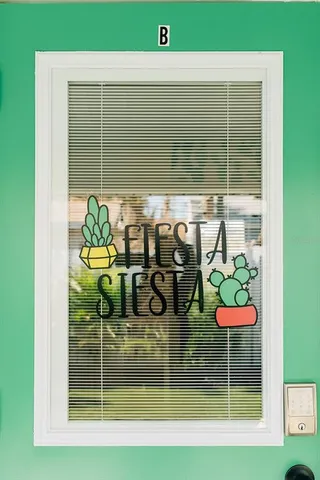 a view of swimming pool from a dining room