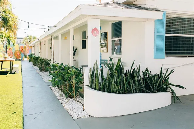 a view of a white tub sitting in front of house