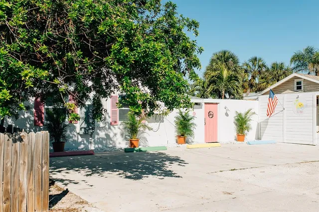 a view of a yard with potted plants