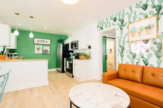 a living room with furniture and a table