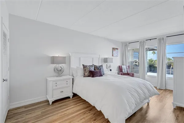 a bedroom with a bed and a night stand