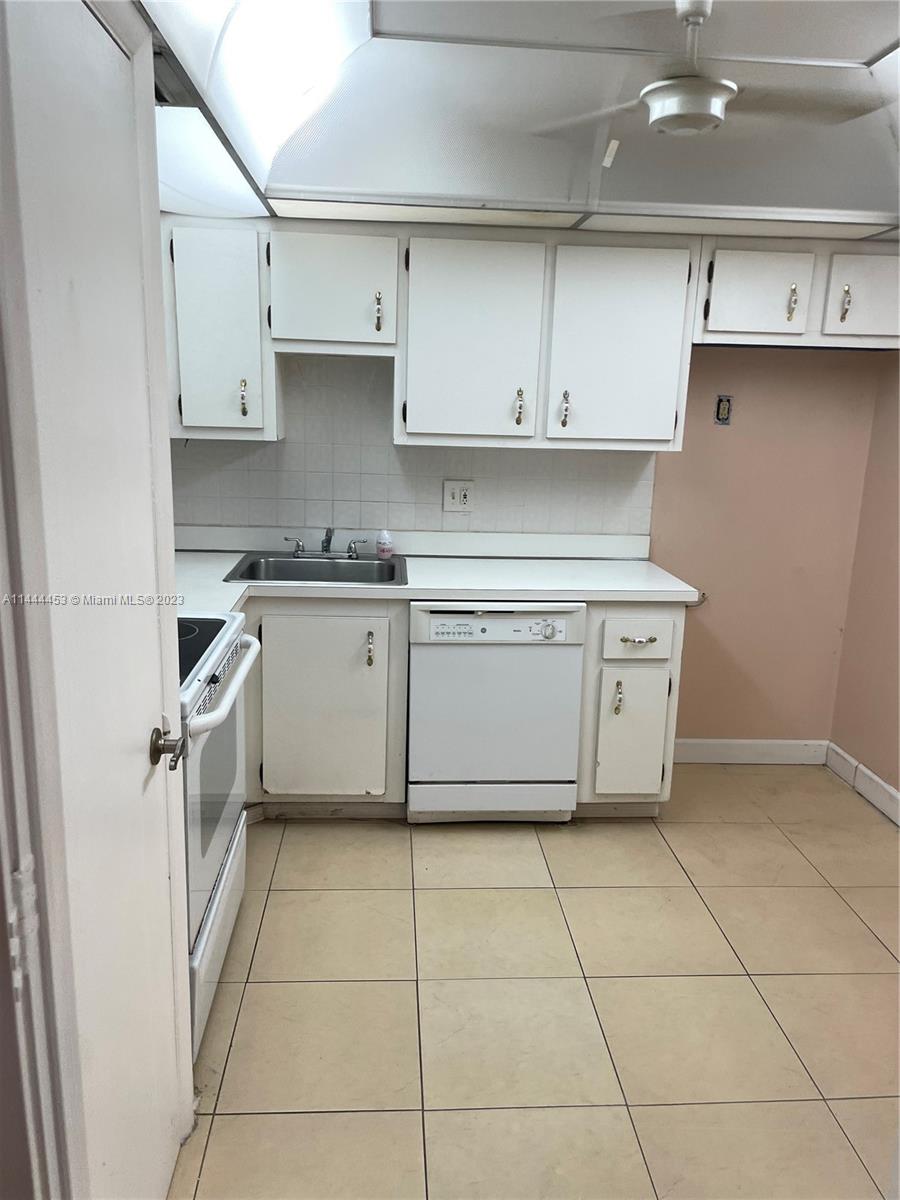 Inverrary Lauderhill, FL 33319 - Photo 18 of 23 a kitchen with stainless steel appliances granite countertop a stove a sink and a refrigerator