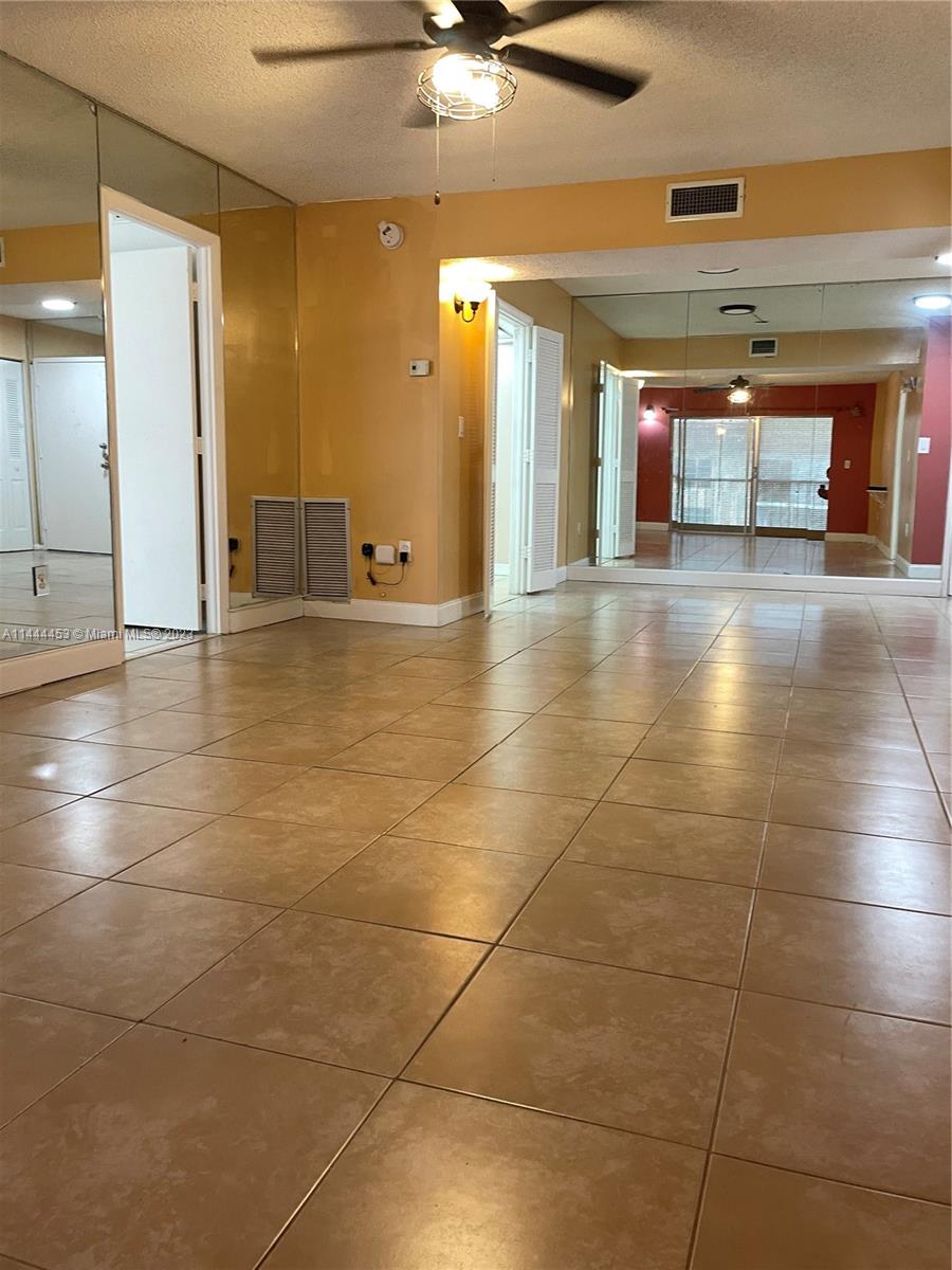 Inverrary Lauderhill, FL 33319 - Photo 2 of 23 a view of a hallway with wooden floor