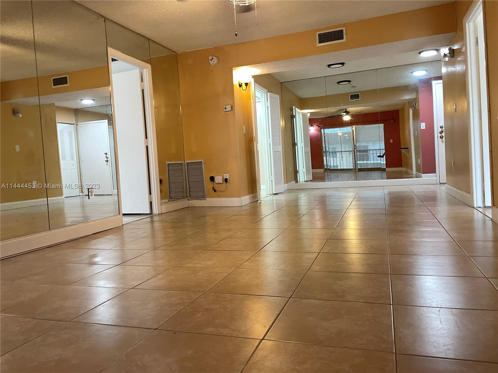 Inverrary Lauderhill, FL 33319 - Photo 6 of 23 a view of a hallway with wooden floor