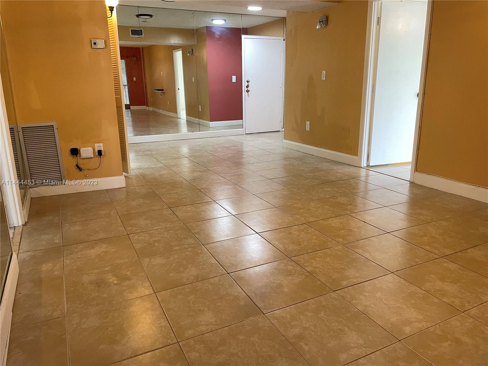 Inverrary Lauderhill, FL 33319 - Photo 8 of 23 a view of a hallway with wooden floor