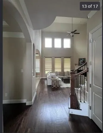 a living room with wooden floor furniture and a window