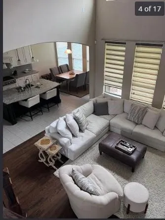 a living room with furniture and a window