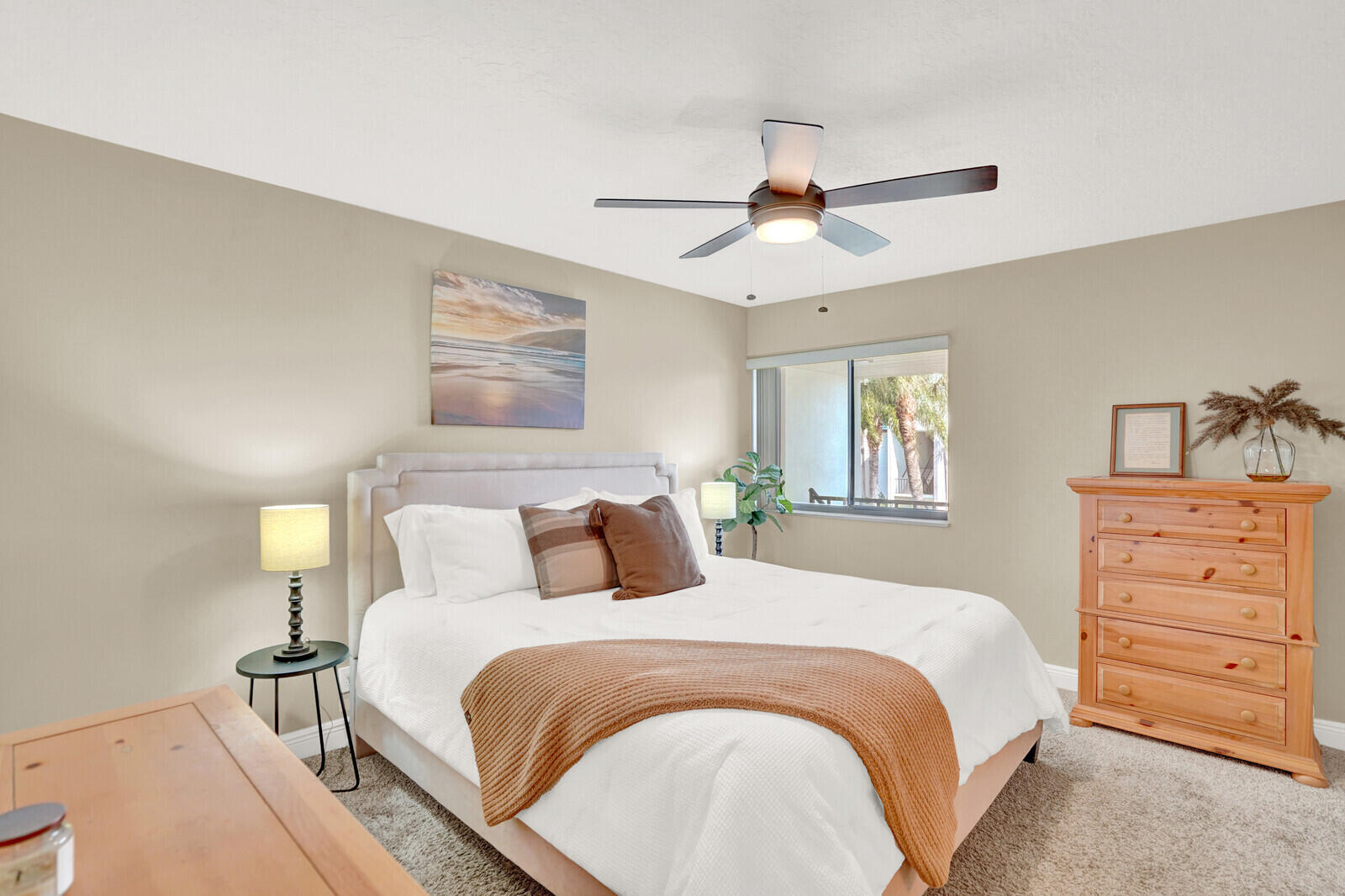 1605 Highway 1, Unit 202V5 Jupiter, FL 33477 - Photo 14 of 26 a bedroom with a bed and a dresser