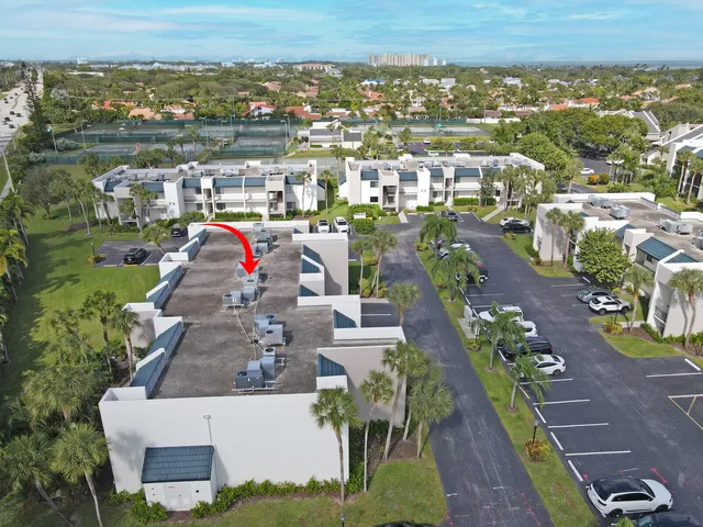 an aerial view of a house with a ocean view