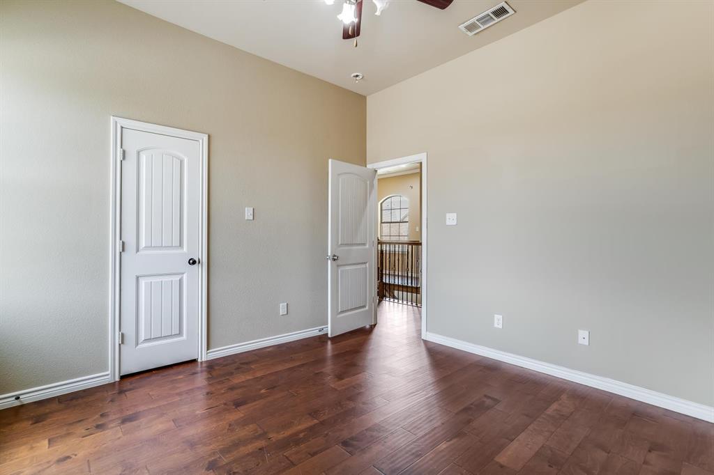 12364 Halima Street Dallas, TX 75243 - Photo 22 of 30 Vaulted ceiling, wood-finish flooring, paneled interior doors, and a ceiling fan